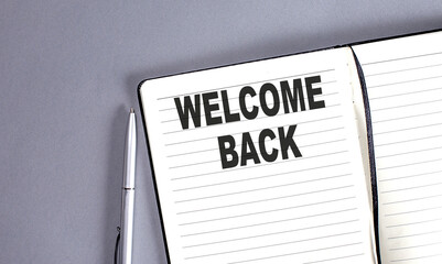 WELCOME BACK word on the notebook with pen