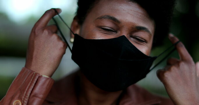 Woman Removing Covid Face Mask Feelijng Relief, End Of Pandemic