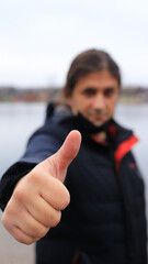 person with thumb up