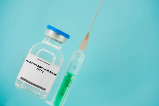 Parathyroid hormone (PTH). Test tube with artificial hormone on pink background Parathyroid hormone (PTH)