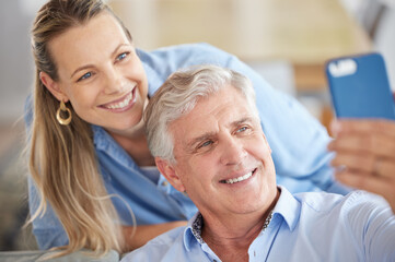 Obraz premium Daughter selfie, senior love and father happy on video call with woman, smile for online communication and live streaming on mobile app in house. Dad and girl taking family photo on tech in home