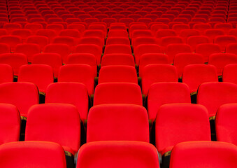 Red chairs in the cinema and theater hall.