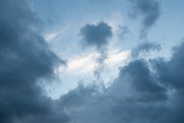 Naklejka na ściany i meble Blue cumulus clouds, one with a cloud looks like a heart. Romantic sky.