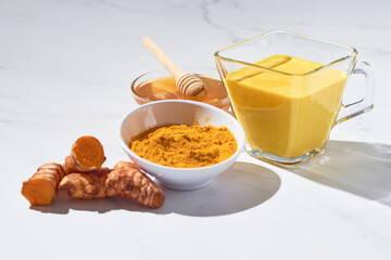 Traditional indian drink turmeric curcuma golden milk with ingredients