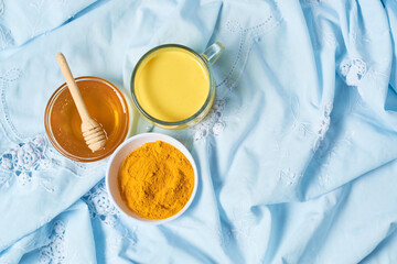 Traditional indian drink turmeric curcuma golden milk with ingredients