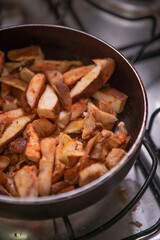 Vegetarian and vegan cuisine using Shitake mushroom and cream for preparation on the stove.