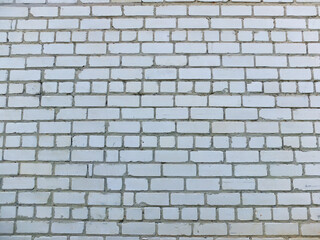 White brick wall with gray cement