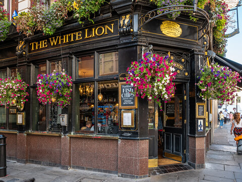London, United Kingdom. Circa September 2022. Facade of a traditional english pub in Covent Garden in the heart of London's West End on a sunny day