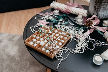 Christmas toys balls lie in a box for decorating a Christmas tree