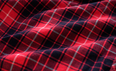 Red tartan fabric, plaid cotton fabric. Textile background, close-up