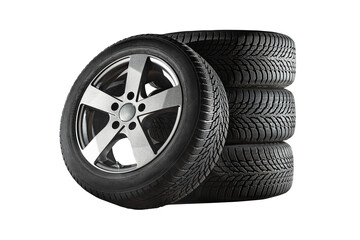 Fototapeta Car tires with a great profile in the car repair shop.  Set of summer or winter tyres in front of white fond. On transparent PNG background. obraz