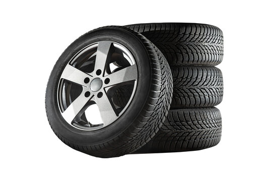 Car tires with a great profile in the car repair shop.  Set of summer or winter tyres in front of white fond. On transparent PNG background.