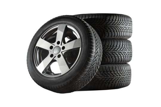 Car tires with a great profile in the car repair shop.  Set of summer or winter tyres in front of white fond. On transparent PNG background.