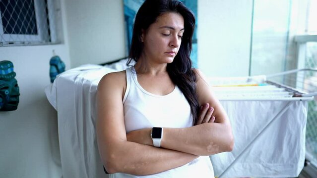 Pensive angry woman with arms crossed. Casual person pondering problems. Adult with mental rumination
