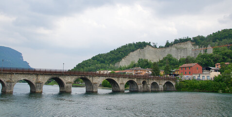 Medieval bridge across River Adda in Lake Como, Italy - obrazy, fototapety, plakaty