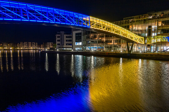 Copenhagen, Denmark  A Pedestrian Bridge At The Aalborg University Copenhagen Branch Lit Up In Ukrainian Flag Colors.