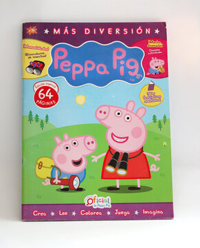 Magazine for children of the character Peppa Pig. Peppa, George, Daddy Pig and Mummy Pig in their family car. Cartoon for babies and toddlers. Activity book for kids. Book to paint, read and cut.