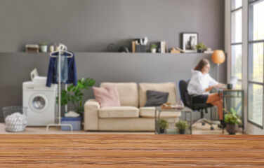 Wooden table close up and decorative grey room background style, blur detail.