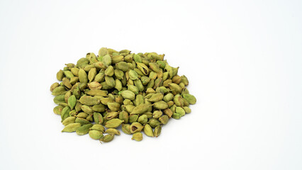 Cardamom pods and seeds isolated on white background. Green cardamom pods isolated on white background with copy space for text or images. Spices, food, cooking concept. Close-up shot.