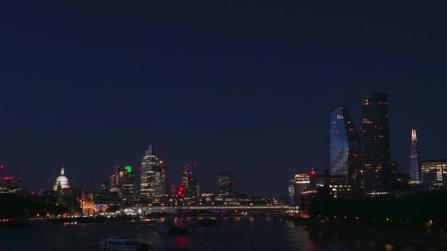 London skyline and Thames river at night. United Kingdom. Time lapse.