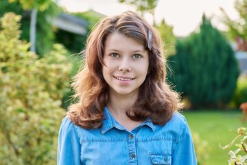 Portrait of a teenage girl 12, 13 years old outdoor