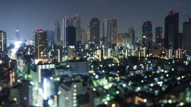 Night time lapse of the till buildings of Shinjuku in Tokyo Japan. Shot with a tilt-shift lens for a miniature effect.