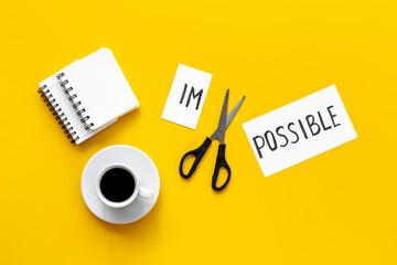 It is possible concept. Word Impossible becomes Possible with scissors