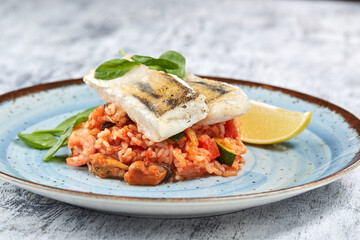 white fish with rice and vegetables