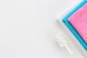 Laundry detergents powder with scoop and fresh towels