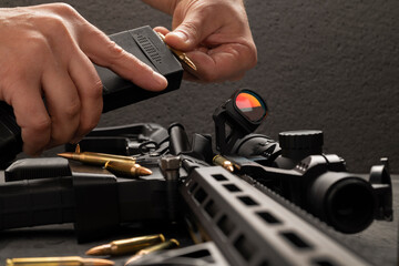 Equipping the AR 5 magazine with 5.56x45 cartridges. Shops, .223 cartridges and AR 15 rifle.