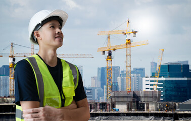 Asian civil engineer or architecture,professional worker man wearing white hat looking forward to success,young adult man working at construction site ,Concept work in success.