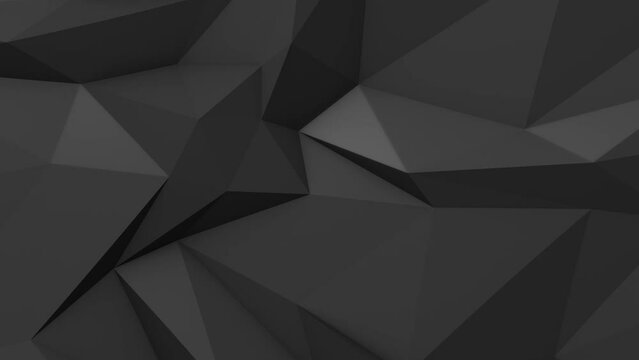 Closeup of dark gradient 3D geometric triangle shapes moving organically in a loop