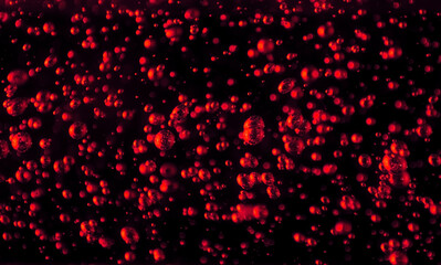 Naklejka na ściany i meble Bubbles close-up on a black background. Oxygen cocktail. Carbonated drink with lots of bright bubbles.