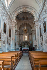 Fototapeta na wymiar Interior of baroque style Chiesa di San Giuseppe Cathedral. Beautiful majestic basilica at townsquare in old coastal city. Details and design in famous tourist attraction.