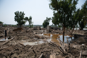 mud-filled village after a natural disaster in Pakistan. Everything is destroyed by floods. Man...