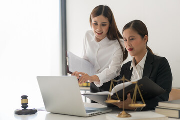 Law and justice concept, Two female lawyers discussing about contract and agreement of business