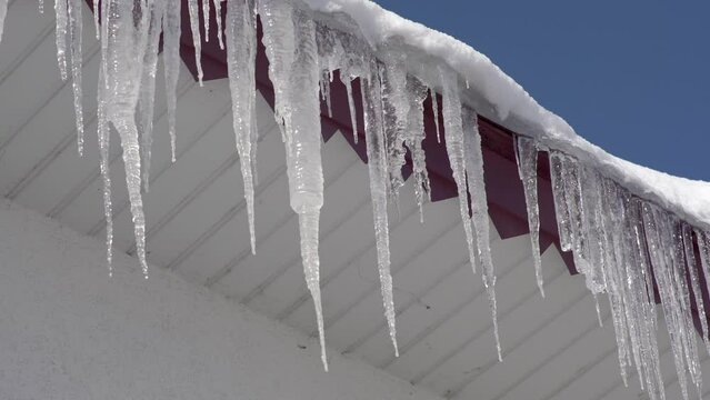 icicles on the roof,icicles melt on the roof in winter
