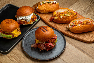 varied fast food. hot dogs with different sausages, burgers