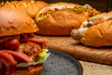 varied fast food. hot dogs with different sausages, burgers