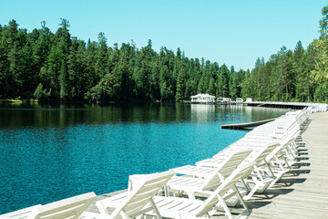 Sun beds in the tourist area on the lake