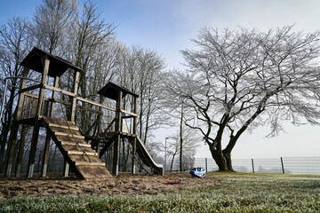 Hoar frost, also hoarfrost, radiation frost, or pruina, at an abandoned playground during Covid 19,...