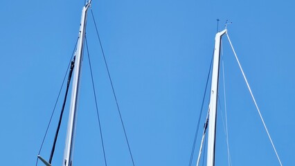 Genova, Italy- July 27, 2022:Panorama of the blue sea, light above the water, ocean sunrise. Some little waves in winter days. Clear sky reflected on the water.