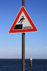 Traffic sign 'Attention water' at the port of list