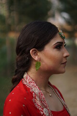 girl wearing red suit and fire in backdrop