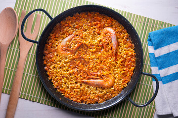 Traditional Spanish paella with red prawns from Ibiza. Typical recipe with seafood from the famous Spanish tapa.