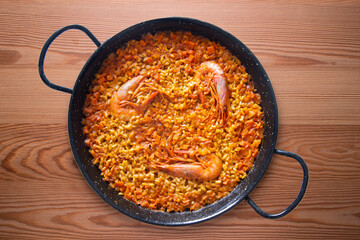 Traditional Spanish paella with red prawns from Ibiza. Typical recipe with seafood from the famous Spanish tapa.