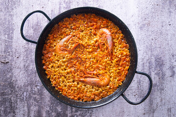 Traditional Spanish paella with red prawns from Ibiza. Typical recipe with seafood from the famous Spanish tapa.