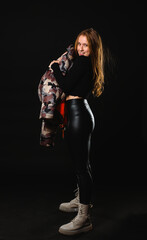 Young casual woman style portrait isolated over dark background