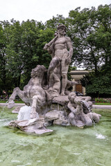 Fototapeta na wymiar The Neptune Fountain in the old Botanical Garden of Munich, Germany