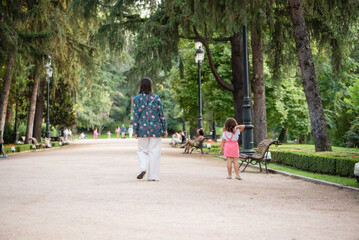 mother and daughter walking in the park